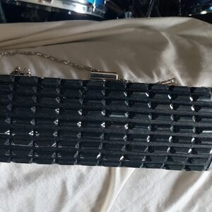 Black hard shell Clutch Unbranded Clasp Top inside zip Pocket removeable chain